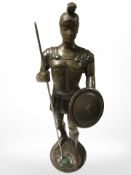 A patinated metal figure of a classical warrior, height 25 cm.