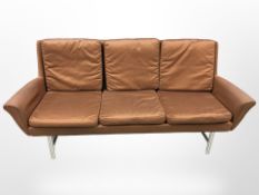 A mid-century three seater settee on chrome legs, width 194 cm.