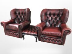 A pair of Oxblood leather Chesterfield armchairs,