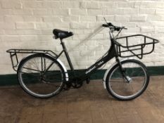 An Elephant lady's shopper bike.