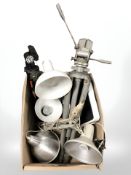 A group of camera tripods, angle poised lamps.