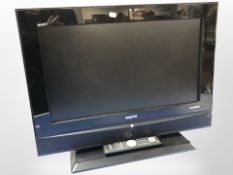 A Sanyo 26 inch LCD TV with lead and remote