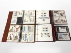 Six albums of Royal Mail postcards, Great British stamps, etc.