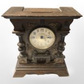 An early 20th century beech mantel clock, height 27 cm.