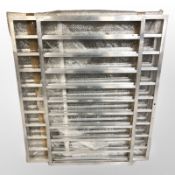 Four aluminium racks, widest 97 cm.