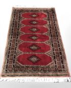 A Lahore Bokhara rug, Pakistan, 163 cm x 96 cm.