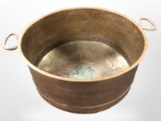 A twin handled copper cooking pot, diameter 62 cm.