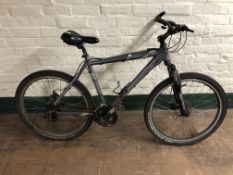 A Claude Butler Stone River mountain bike.