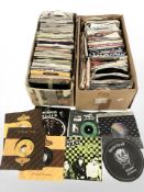 A large quantity of vinyl 7 inch singles including The Police, Rainbow, Motorhead,