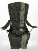 A folding travel armchair in carry bag.