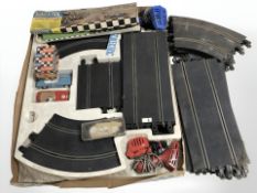 A vintage Scalextric racing set with cars and track.