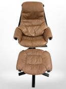 A continental 20th century tan leather relaxer chair with footstool
