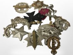 Twelve army cap badges (some reproductions).