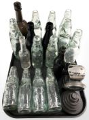A group of antique glass bottles bearing advertising including various makers from Newcastle,