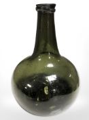 A Georgian green glass string-necked wine bottle, labeled Michael Briggs Collection,