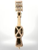 An African tribal carving, length 75 cm.