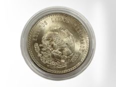 A Mexican 5 Pesos 1948 0.900 silver coin, 29.9g.