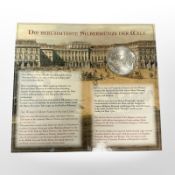 A commemorative Maria Theresa Taler 833.3 silver coin, 28.07g, on presentation card.
