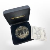 A Queen Elizabeth II 2012 0.958 silver Brittania coin, 32.45g, cased.