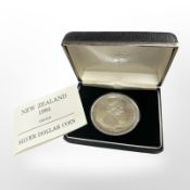 A Queen Elizabeth II 1984 New Zealand 0.925 silver proof dollar, 27.7g, cased.