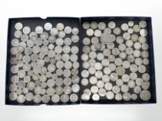 A group of coins including one shillings, 20 pences,