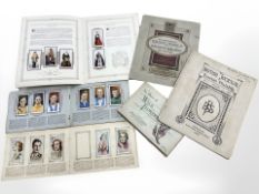 A small group of early 20th century cigarette card albums, 1937 Coronation albums, etc.