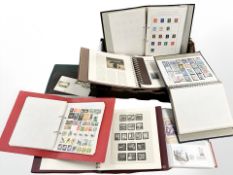 A box of seven stamp albums including 20th century stamps of the world etc