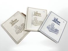 Three albums of Disney World postage stamps