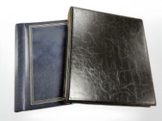 Two albums containing a collection of bank notes and world currency.