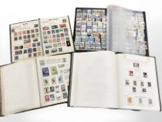 Four albums of vintage stamps, early 20th century and later.