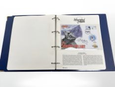 An album of autographed first day cover editions.