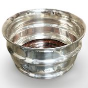 A silver bottle coaster, Birmingham marks.