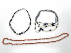 A multi-strand necklace with pearl and coloured crystal together with lapis necklace and rough cut