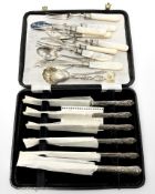 A group of cutlery to include a set of six Sheffield steel butter knives, with silver handles,