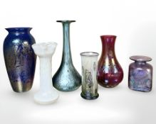 A group of iridescent art glass vases, tallest 22 cm.