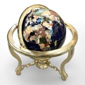 A gemstone globe on brass stand,