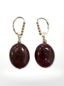 A pair of 14ct yellow gold egg shaped ruby earrings