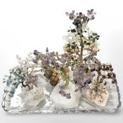 A group of six miniature gemstone tree ornaments, examples of Amethyst, Carnelian, Pink quartz,