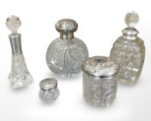 A group of five crystal dressing table items with silver mounts.