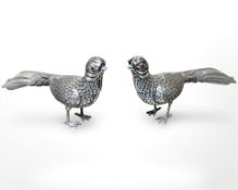 A pair of antique Portuguese silver figures of pheasants with garnet eyes, approximate length 17 cm.