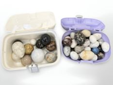 A large group of polished marble and hard stone eggs and spheres.