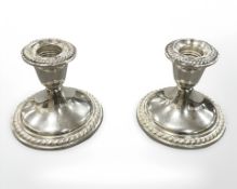 A pair of sterling silver squat candlesticks, height 9 cm.