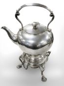 An antique silver-plated spirit kettle on stand, height 34 cm.