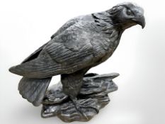 A contemporary bronze-effect figure of an eagle, standing on plinth, height 19.5 cm.