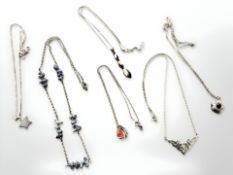 A group of jewellery including Sterling silver pendants on chains,