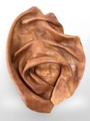 An unusual leather work portrait of a woman