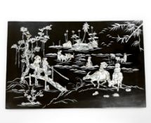 A Japanese mother of pearl inlaid inlaid lacquered panel,