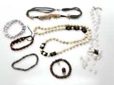 A group of jewellery items including necklaces, bracelets, polished stone cuff bracelet,