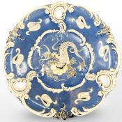 A continental ceramic plaque with dragon decoration,