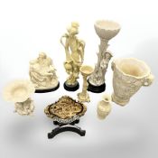 A group of eight contemporary carved figures, vases and panel on stand, tallest 30 cm.